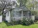 Charming single-story home with white brick, blue shutters, and small front porch at 2517 Baur Dr, Indianapolis, IN 46220