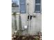 Exterior brick wall with window, utility boxes, and wall mounted candle holders at 2517 Baur Dr, Indianapolis, IN 46220