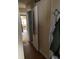 Hallway with wood floors leading to other rooms showcasing the interior layout of the home at 2517 Baur Dr, Indianapolis, IN 46220