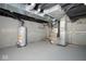 Basement utility area with an HVAC system, water heater, and painted walls and floors at 2714 N Capitol Ave, Indianapolis, IN 46208