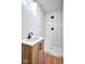 Contemporary bathroom featuring a modern vanity, quartz countertop, and a tiled walk-in shower at 2714 N Capitol Ave, Indianapolis, IN 46208