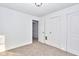 Bright bedroom featuring neutral carpeting, fresh paint, and two closets at 2714 N Capitol Ave, Indianapolis, IN 46208