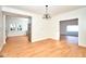 Open-concept dining room with stainless steel appliances and hardwood floors at 2714 N Capitol Ave, Indianapolis, IN 46208