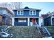 Charming two-story home featuring a bright red front door, blue siding and a welcoming front porch at 2714 N Capitol Ave, Indianapolis, IN 46208