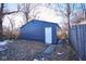 Backyard with a detached single-car garage featuring painted siding, trim and concrete walkway at 2714 N Capitol Ave, Indianapolis, IN 46208