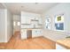 Open kitchen with stainless steel appliances and wood-look flooring at 2714 N Capitol Ave, Indianapolis, IN 46208