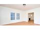 Inviting living room featuring hardwood floors, a modern light fixture, and fresh white walls at 2714 N Capitol Ave, Indianapolis, IN 46208