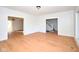 Spacious living room boasts hardwood floors, fresh paint, and an open floor plan with staircase access at 2714 N Capitol Ave, Indianapolis, IN 46208