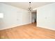 Bright living room features hardwood floors, a classic light fixture, and entry door at 2714 N Capitol Ave, Indianapolis, IN 46208
