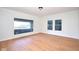 Bright living room with hardwood floors and large windows, providing ample natural light at 2714 N Capitol Ave, Indianapolis, IN 46208