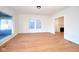 Open living room featuring hardwood floors, freshly painted walls, and lots of natural light at 2714 N Capitol Ave, Indianapolis, IN 46208