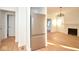Bright living room featuring stainless steel refrigerator and fireplace at 2714 N Capitol Ave, Indianapolis, IN 46208