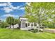 Inviting backyard featuring a covered patio, well-manicured lawn, and mature trees offering shade and privacy at 2979 Kings Ct, Carmel, IN 46032