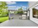 Outdoor kitchen and seating area with built-in grill on the backyard deck at 2979 Kings Ct, Carmel, IN 46032