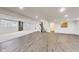Versatile basement area combines cozy carpeting, modern flooring, and ample lighting for flexible use at 2979 Kings Ct, Carmel, IN 46032