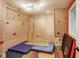 Basement with custom climbing wall and climbing pads at 2979 Kings Ct, Carmel, IN 46032