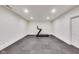 Spacious basement area featuring rubber floors, recessed lighting, and plenty of room for activities at 2979 Kings Ct, Carmel, IN 46032