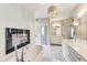 Spa-like bathroom showcasing a modern soaking tub, fireplace, and bright finishes at 2979 Kings Ct, Carmel, IN 46032