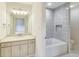 Bright bathroom with a tiled shower and tub combo, complete with stylish vanity and hardware at 2979 Kings Ct, Carmel, IN 46032