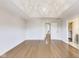 A well-lit bedroom showcasing a tray ceiling and hardwood floors, perfect for relaxation and rest at 2979 Kings Ct, Carmel, IN 46032