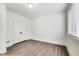 Bright bedroom with light-colored walls, wood floors, double door closet, and large window at 2979 Kings Ct, Carmel, IN 46032