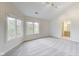 Bedroom featuring large windows, plush carpets, and access to a nearby bathroom, creating a comfortable retreat at 2979 Kings Ct, Carmel, IN 46032