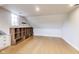 Bonus room with wooden floors and built-in storage units offers great potential for a playroom, office, or hobby space at 2979 Kings Ct, Carmel, IN 46032