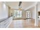 Well-lit dining area with hardwood floors, built-in cabinets, and a view of the front yard at 2979 Kings Ct, Carmel, IN 46032