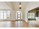 Bright foyer with hardwood floors and high ceilings leading to a well-lit entry at 2979 Kings Ct, Carmel, IN 46032