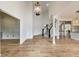 Spacious foyer with hardwood floors, high ceilings, staircase, and modern light fixture at 2979 Kings Ct, Carmel, IN 46032