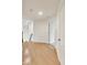 Bright hallway with hardwood floors and white trim at 2979 Kings Ct, Carmel, IN 46032