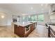 Open-concept kitchen boasts an island, modern appliances, and a seamless flow to the living area at 2979 Kings Ct, Carmel, IN 46032