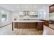 Bright kitchen features an island, stainless steel appliances, and modern cabinetry at 2979 Kings Ct, Carmel, IN 46032
