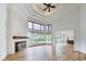 The living room has a fireplace and large windows for natural light at 2979 Kings Ct, Carmel, IN 46032
