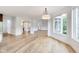 Living room featuring wood floors, an abundance of light, and a view to the front of the home at 2979 Kings Ct, Carmel, IN 46032
