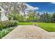 Stone patio in backyard showcasing design and outdoor living space with lush greenery at 2979 Kings Ct, Carmel, IN 46032
