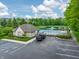 Community pool and building with ample parking, landscaping, and recreational facilities at 2979 Kings Ct, Carmel, IN 46032