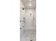 Luxurious shower with multiple shower heads and built-in bench seating at 2979 Kings Ct, Carmel, IN 46032