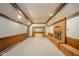 Finished basement featuring a fireplace, wood trim, and carpeted floors at 310 Edgewood E Pl, Anderson, IN 46011