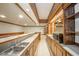 Finished basement wet bar with wood cabinets, sink, and views to game room at 310 Edgewood E Pl, Anderson, IN 46011