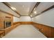 Carpeted basement with brick fireplace, wood trim and built in seating at 310 Edgewood E Pl, Anderson, IN 46011