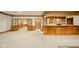 Large finished basement with a bar area, fireplace, and ample space at 310 Edgewood E Pl, Anderson, IN 46011