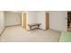 Large unfinished basement with ample open space and multiple doors at 310 Edgewood E Pl, Anderson, IN 46011