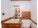 Bathroom featuring a wood vanity and sink, toilet, mirror, and light fixture at 310 Edgewood E Pl, Anderson, IN 46011