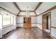 Dining room with hardwood floors, chandelier, and natural light at 310 Edgewood E Pl, Anderson, IN 46011