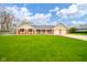 Charming brick home with well-manicured lawn and an attached two-car garage at 310 Edgewood E Pl, Anderson, IN 46011