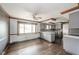 Gray kitchen with stainless steel appliances, hardwood floors, and a large window at 310 Edgewood E Pl, Anderson, IN 46011