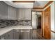 Kitchen with gray cabinets, white countertop, stainless steel appliances, and hardwood floors at 310 Edgewood E Pl, Anderson, IN 46011