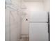 Pantry provides ample storage with metal shelving and space for an additional refrigerator at 310 Edgewood E Pl, Anderson, IN 46011