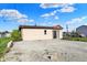 Exterior view of home featuring a gravel lot and grassy area at 3104 Poplar St, Anderson, IN 46012